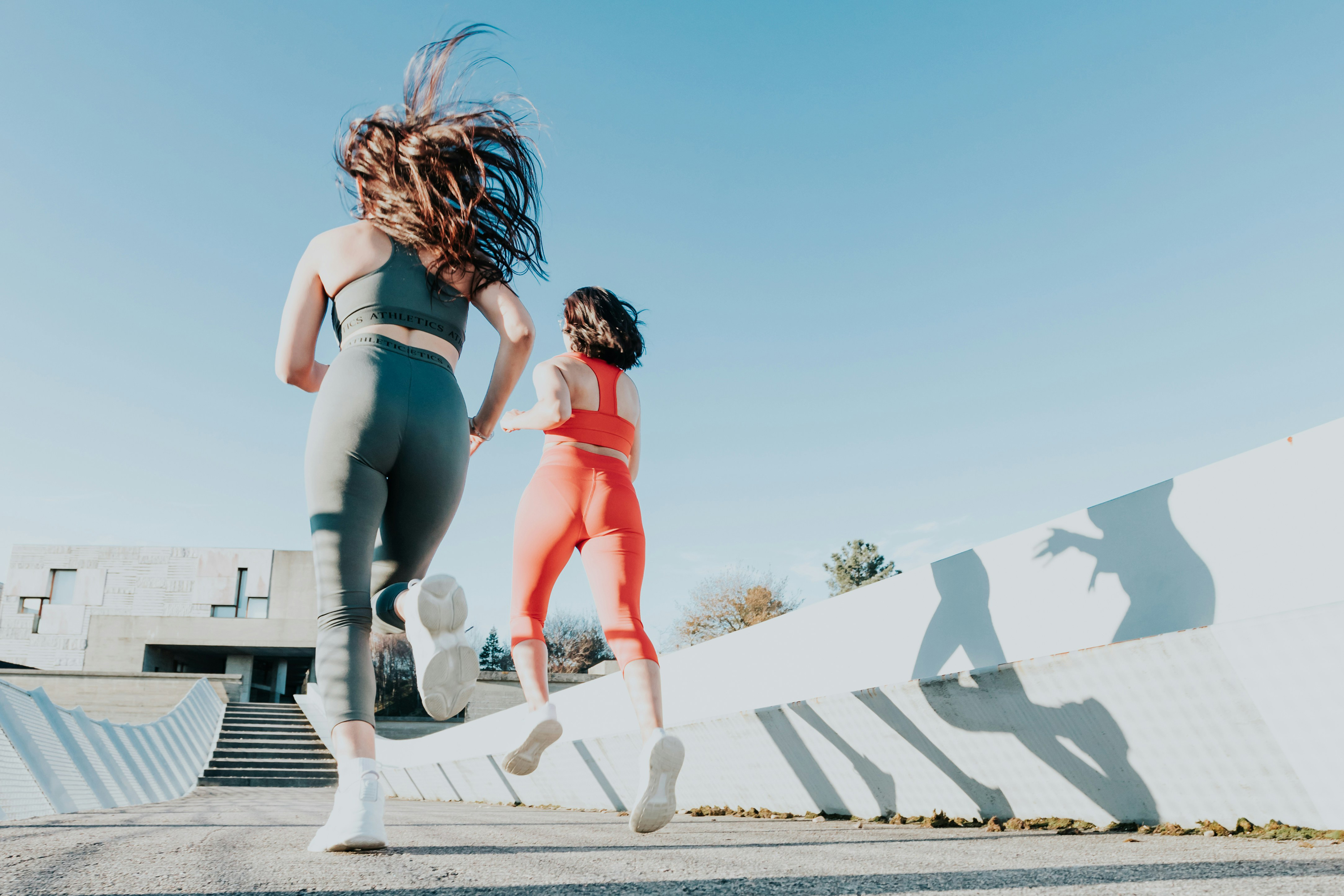 Two women running outdoors